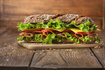 Image showing Sandwich on the wooden table