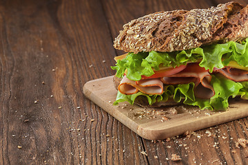 Image showing Sandwich on the wooden table