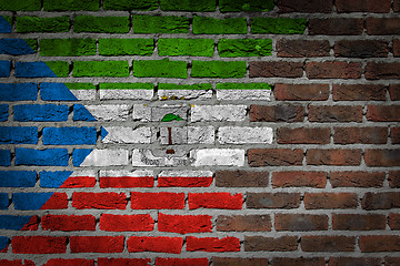 Image showing Brick wall texture with flag