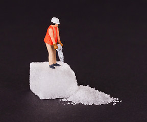 Image showing Miniature worker working on a sugar cube