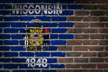 Image showing Brick wall texture with flag