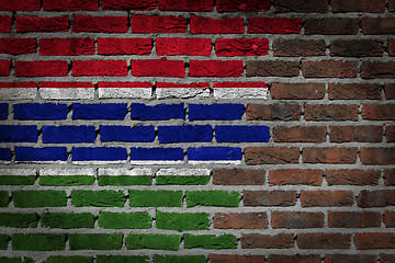 Image showing Brick wall texture with flag