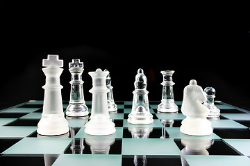Image showing Chess Pieces on a glass board