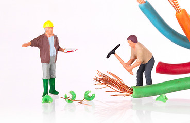 Image showing Miniature worker with pickaxe