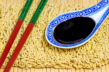 Image showing raw chinese noodles with soy sauce