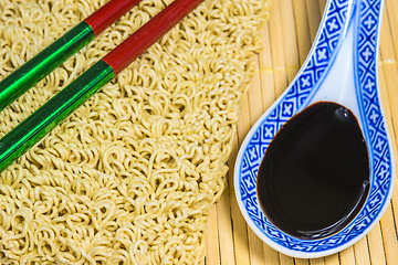 Image showing raw chinese noodles with soy sauce