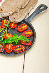 Image showing baked cherry tomatoes with basil and thyme