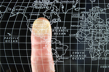 Image showing Finger on world Map