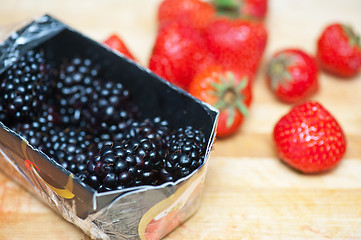 Image showing Fresh strawberries and blackberries