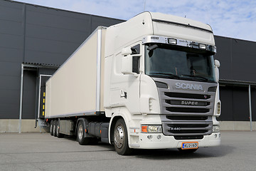 Image showing White Scania R440 Semi Truck by a Warehouse