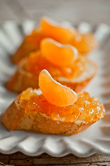 Image showing pieces of baguette with orange marmalade