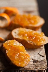 Image showing pieces of baguette with orange marmalade