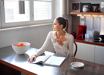 Image showing Relaxed girl looking out the window 