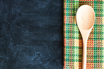 Image showing wooden spoon and tablecloth 