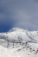 Image showing Ski slope and ropeways in evening