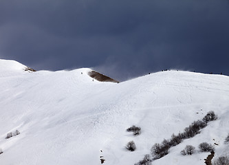 Image showing Off piste slope and overcast gray sky in windy day