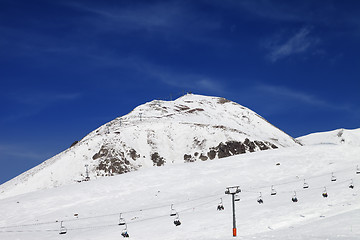 Image showing Winter mountains and ski slope at nice day