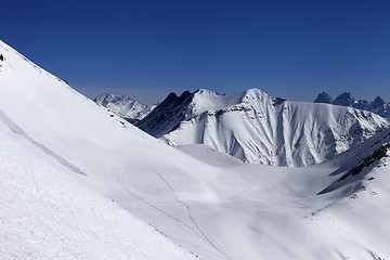 Image showing View on snowy off piste slope with trace from avalanche