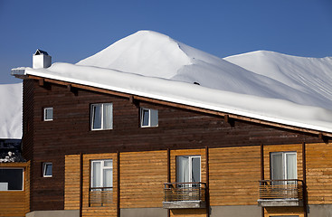 Image showing Snowy hotel in winter mountains at nice day