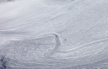 Image showing Snowboarders and skiers on ski slope