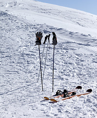 Image showing Skiing equipment on ski slope at sunny day