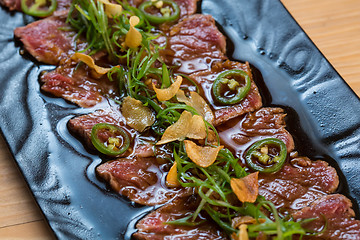 Image showing Beef Carpaccio on dark background