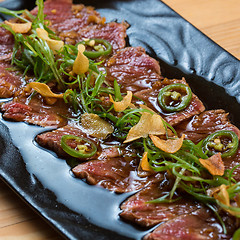 Image showing Beef Carpaccio on dark background