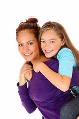 Image showing Mother piggyback her daughter.