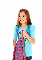 Image showing Girl holding her backpack.