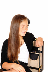 Image showing Smiling girl in briefcase.