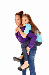 Image showing Mother piggyback daughter.