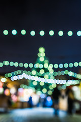 Image showing Decorated Christmas tree. Abstract blurred lights background