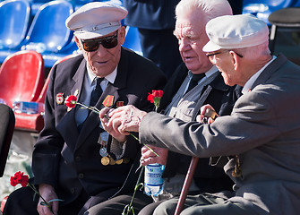 Image showing Senior veterans of World War II meet on tribunes