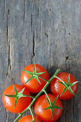 Image showing  ripe cherry tomatoes on wood