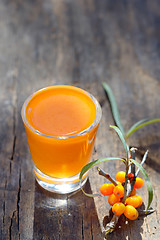 Image showing Sea buckthorn juice and berries