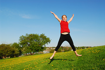 Image showing Young girl jumping