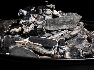 Image showing Closeup of burnt charcoal on a barbeque