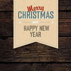 Image showing Merry Christmas VIntage Tag Design On Red Planks. Vector