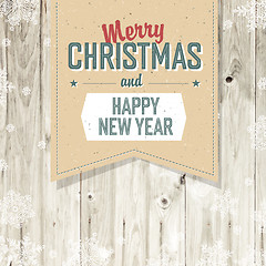 Image showing Merry Christmas VIntage Tag Design On Planks. Vector