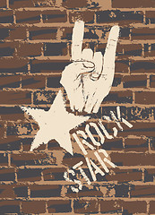 Image showing Rock Star Sign With Horns Gesture On Brick Wall