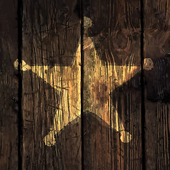 Image showing Grunge sheriff star on wooden texture.