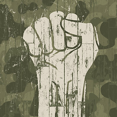 Image showing Fist symbol (revolution) on military camouflage background. Vect