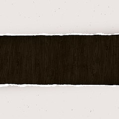 Image showing Torn paper on wooden background. Vector