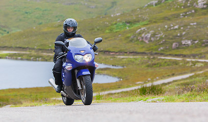 Image showing Motorcyclist in the Scottish Highlands