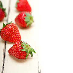 Image showing fresh organic strawberry over white wood