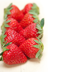 Image showing fresh organic strawberry over white wood