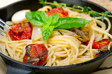 Image showing spaghetti pasta with baked cherry tomatoes and basil 