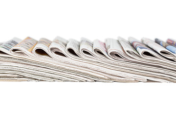 Image showing Assortment of folded newspapers