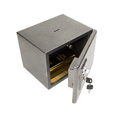Image showing Opened safe with golden piece.