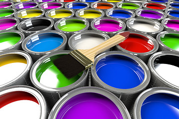 Image showing Multiple open paint cans with a brush. 